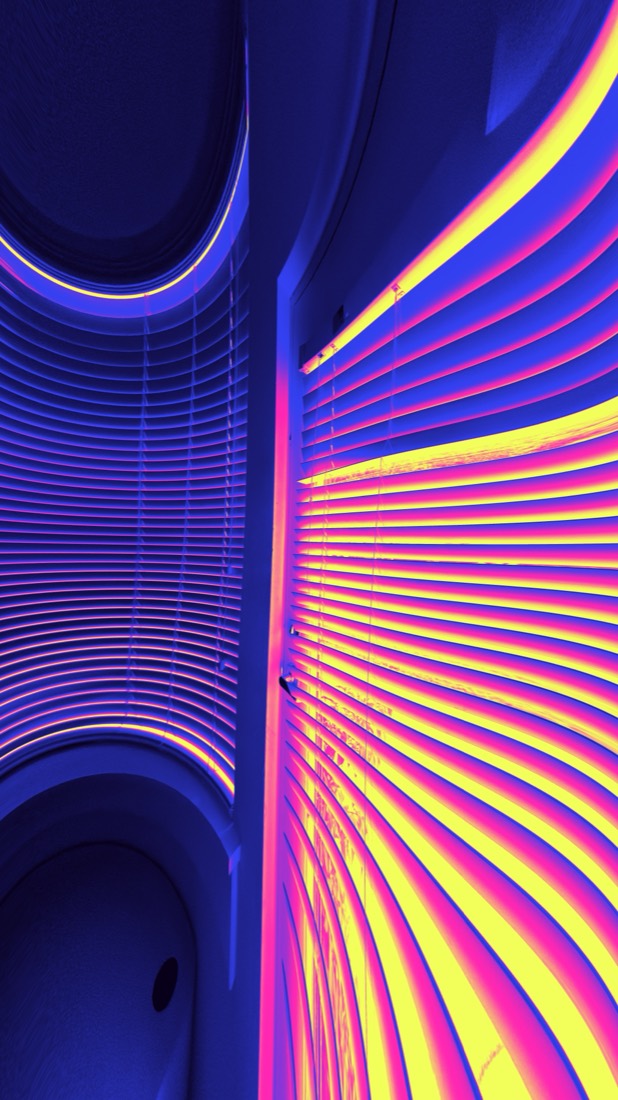 Photo shot with Liquid Lens: neon-lit window blinds